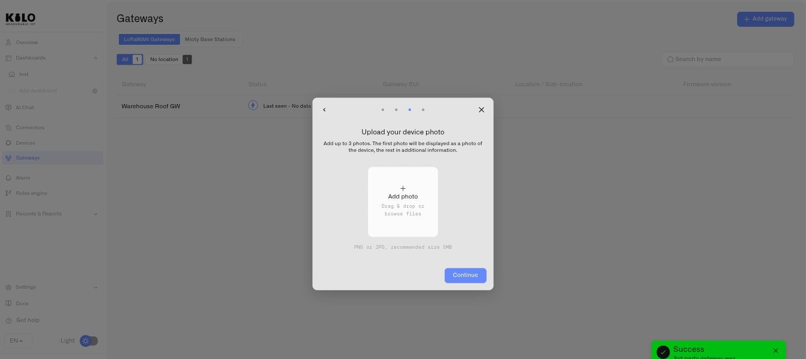 The optional device photo step, with the gateway already listed behind the dialog